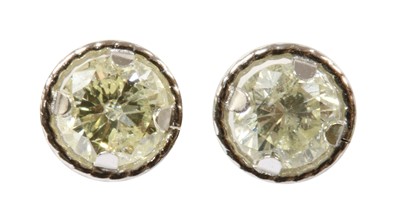 Lot 154 - A pair of white gold diamond stud earrings