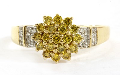 Lot 208 - A 9ct gold diamond and treated yellow diamond ring