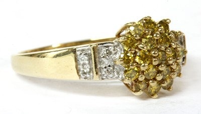 Lot 208 - A 9ct gold diamond and treated yellow diamond ring