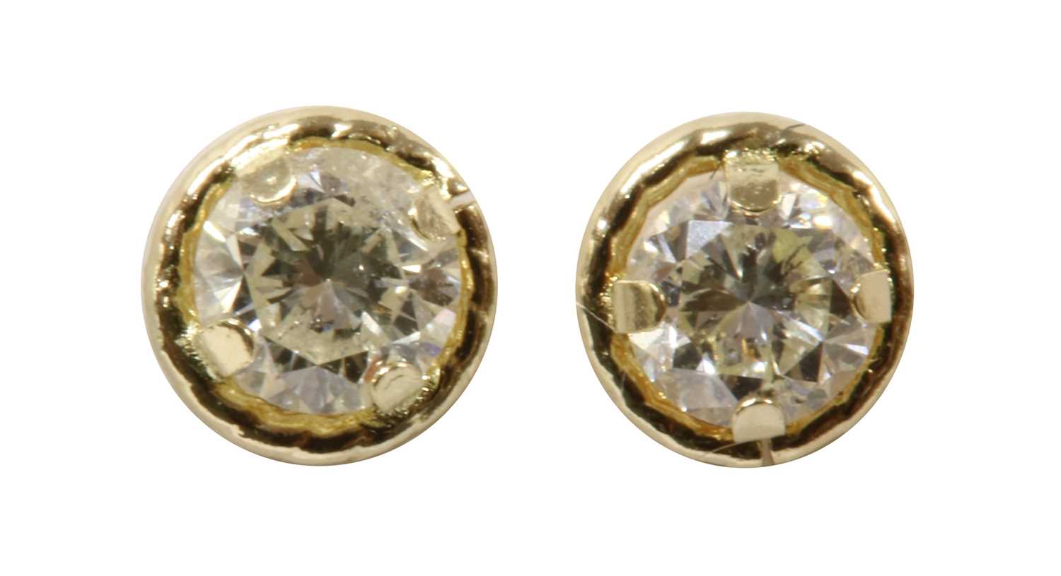 Lot 212 - A pair of gold diamond stud earrings