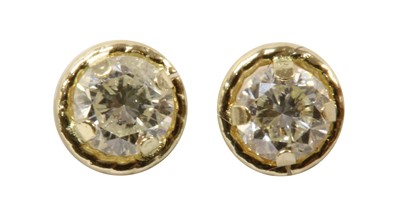 Lot 212 - A pair of gold diamond stud earrings