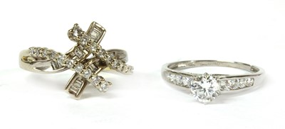 Lot 137 - A white gold diamond crossover dress ring