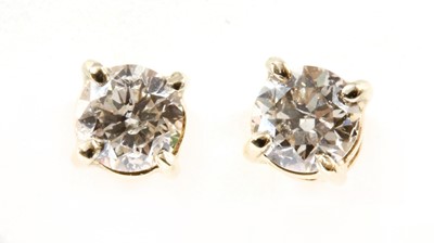 Lot 209 - A pair of gold diamond stud earrings
