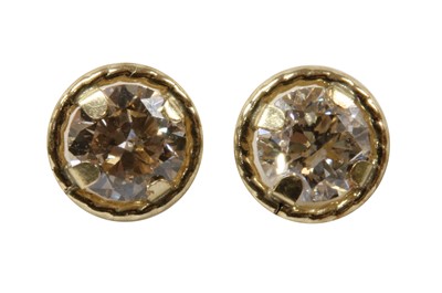 Lot 213 - A pair of gold diamond stud earrings