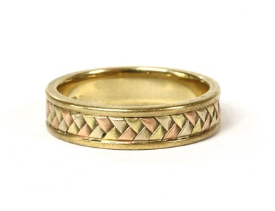 Lot 325 - A 9ct three colour gold plaited wedding ring