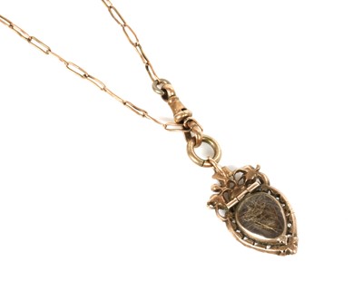 Lot 17 - A Georgian heart-shaped split pearl glazed locket