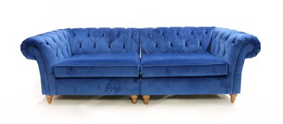 Lot 386 - A contemporary blue velvet upholstered button back Chesterfield sofa