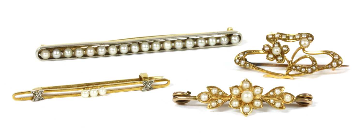 Lot 31 - A platinum and gold pearl bar brooch