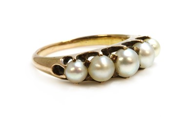 Lot 126 - An Edwardian gold five stone pearl ring