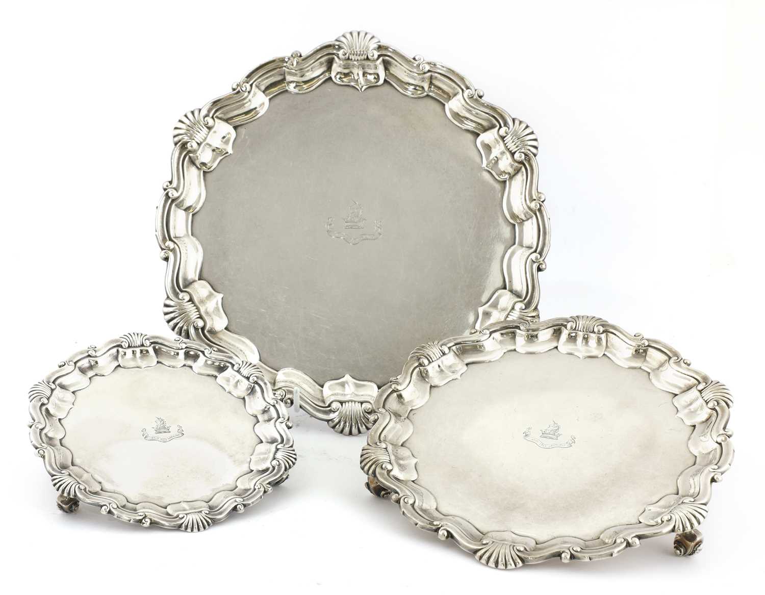 Lot 25 - A set of three graduated silver salvers