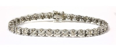 Lot 95 - A white gold diamond line bracelet