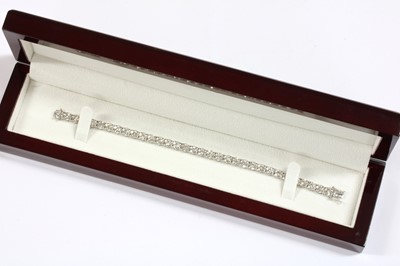 Lot 95 - A white gold diamond line bracelet