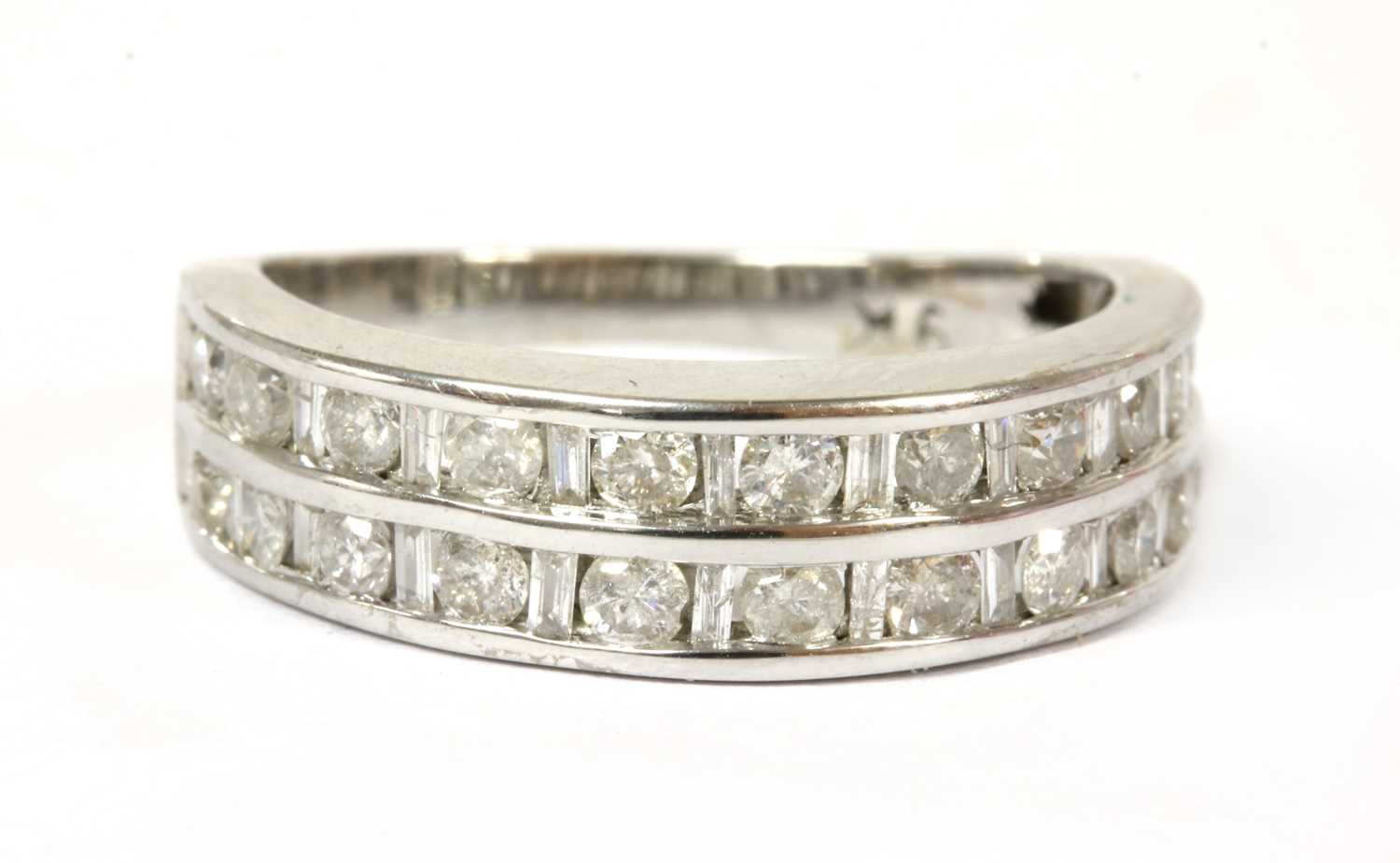 Lot 111 - A white gold diamond half eternity ring