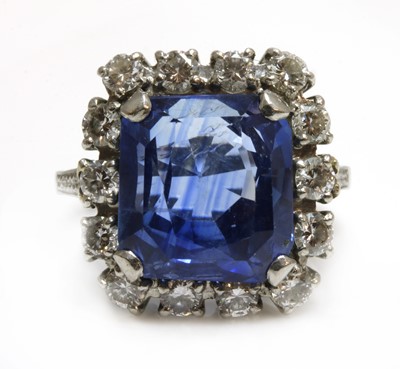 Lot 105 - An American sapphire and diamond cushion-shaped cluster ring