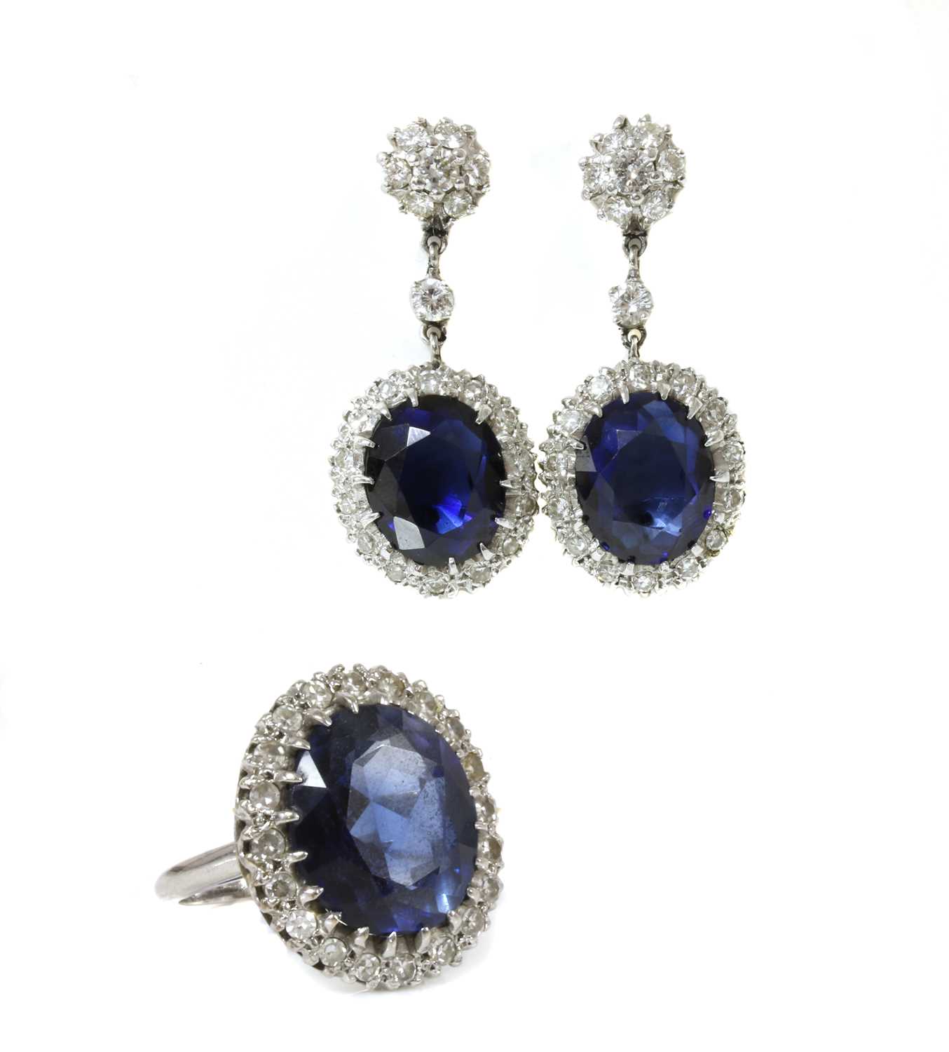 Lot 190 - An American synthetic sapphire and diamond oval cluster ring and earring suite