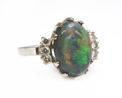 Lot 168 - An American white gold black opal and diamond ring