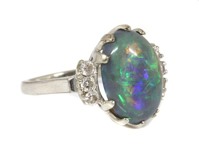 Lot 168 - An American white gold black opal and diamond ring