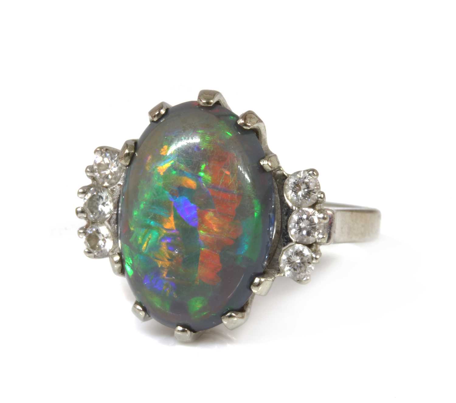 Lot 168 - An American white gold black opal and diamond ring