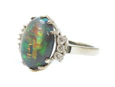 Lot 168 - An American white gold black opal and diamond ring