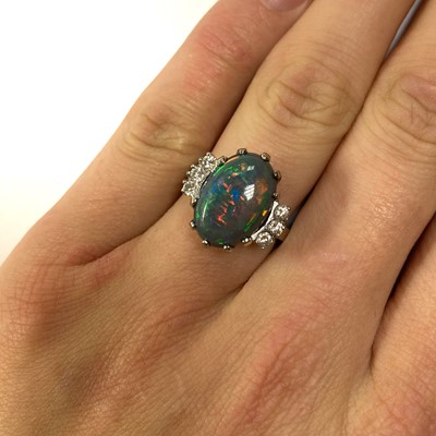 Lot 168 - An American white gold black opal and diamond ring