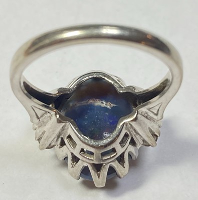 Lot 168 - An American white gold black opal and diamond ring