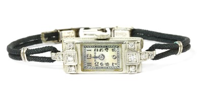 Lot 1519 - An Art Deco Canadian ladies' white gold diamond set cocktail watch, by Birks