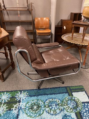 Lot 564 - A Pieff brown leather and chrome lounge chair