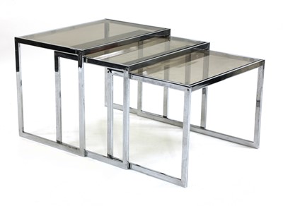 Lot 561 - A nest of three chrome tables