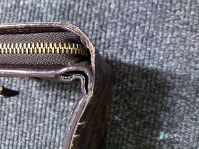 Lot 96 - A Louis Vuitton Damier Ebène compact zip wallet