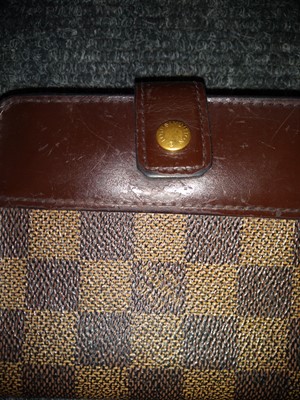 Lot 96 - A Louis Vuitton Damier Ebène compact zip wallet