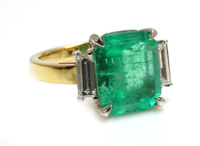 Lot 141 - An 18ct gold emerald and diamond ring