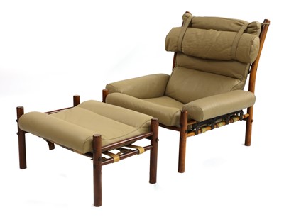 Lot 575 - An 'Inca' armchair and footstool