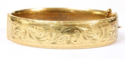 Lot 103 - A 9ct gold oval hinged bangle