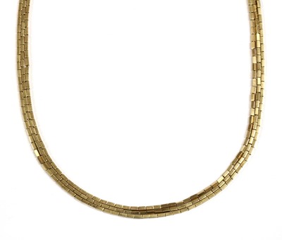 Lot 143 - A gold three row necklace