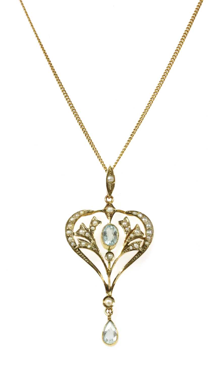 Lot 34 - An Edwardian gold aquamarine and split pearl pendant