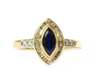 Lot 203 - A gold sapphire and diamond cluster ring