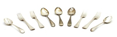 Lot 7 - A collection of associated Georgian bright cut silver flatware