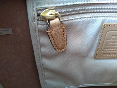 Lot 77 - A Coach tan leather tote bag