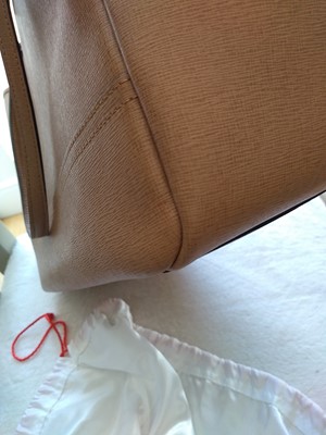 Lot 77 - A Coach tan leather tote bag