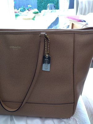 Lot 77 - A Coach tan leather tote bag