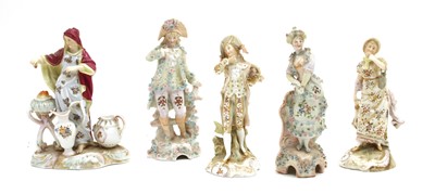 Lot 112 - A pair of Berlin porcelain figures of a man and woman in traditional floral decorated garments