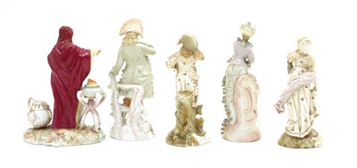 Lot 112 - A pair of Berlin porcelain figures of a man and woman in traditional floral decorated garments