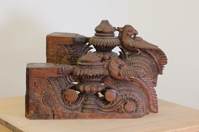 Lot 210A - A pair of Indian carved teak corbels