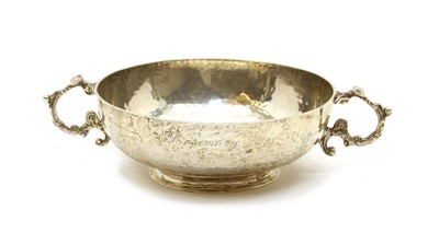 Lot 13 - A silver planished twin handled bowl