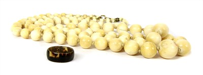 Lot 80A - A two row graduated ivory bead necklace