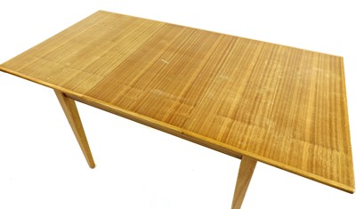 Lot 403 - A Gordon Russell walnut dining table