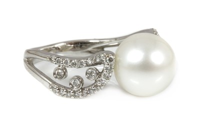 Lot 227 - A Continental single stone cultured South Sea pearl ring with diamond set shoulders