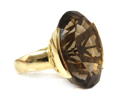 Lot 204 - A gold single stone smoky quartz ring