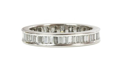 Lot 416 - An 18ct white gold diamond set full eternity ring