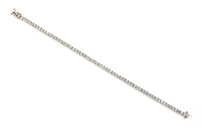 Lot 353 - An 18ct white gold diamond set line bracelet